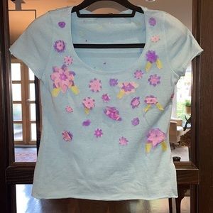 Moschino aqua cap sleeve knit top with pink and purple floral appliqués